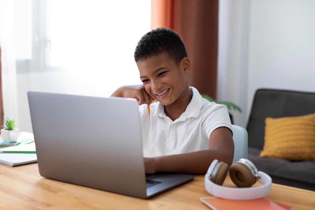 A boy working through an online lesson